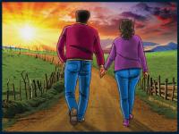 African American couple holding hands while walking along country toward the sunset.